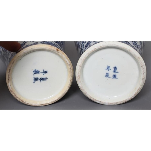 4 - A PAIR OF CHINESE PORCELAIN VASES AND COVERS of inverted baluster form, painted in underglaze blue w... 