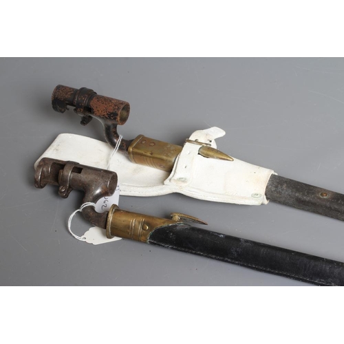 402 - TWO BRITISH PATTERN SOCKET BAYONETS, both with triangular section blades, brass and leather scabbard... 