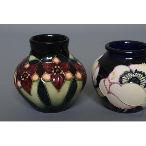 47 - THREE MOORCROFT POTTERY SMALL VASES all of squat globular form and comprising Cherry Blossom, 2012, ... 