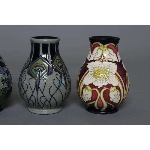 48 - FOUR MOORCROFT POTTERY VASES all of baluster form and comprising Violetta, 2012, and Shrinking Viole... 