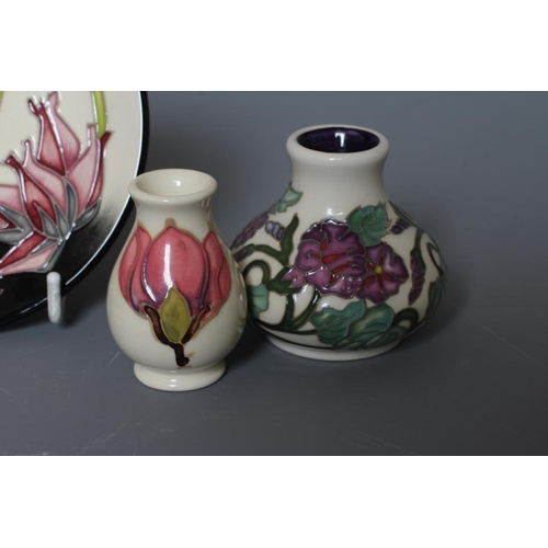 51 - FOUR MOORCROFT POTTERY MINIATURE VASES comprising September Glory, 2017, of squat baluster form, des... 