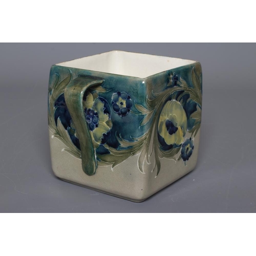 52 - A MOORCROFT POTTERY LATE FLORIAN PATTERN BISCUIT BARREL, early 20th century, of slightly rounded squ... 