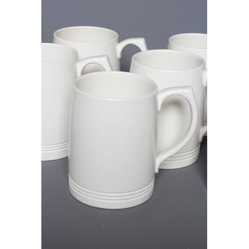 64 - KEITH MURRAY FOR WEDGWOOD - A MOONSTONE LEMONADE SET comprising six mugs and a jug, printed mark in ... 