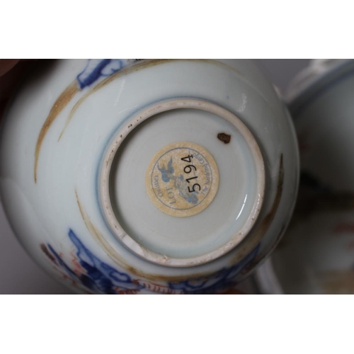 8 - A NANKING CARGO PORCELAIN TEABOWL AND SAUCER painted in underglaze blue and over painted in iron red... 