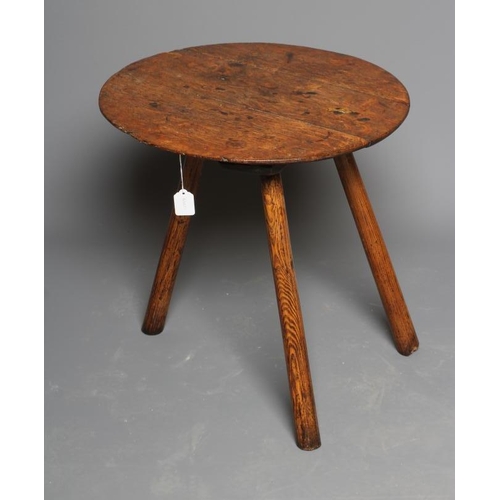 818 - AN OAK CRICKET TABLE, 19th century, the three plank circular top with chamfered lower edge, raised o... 