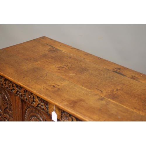 821 - A JOINED OAK PANELLED CHEST, late 17th century and later, the hinged plank lid opening to a void int... 