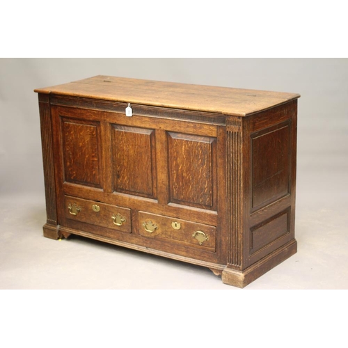 825 - A GEORGIAN JOINED OAK PANELLED CHEST of inverted breakfront form, third quarter 18th century, the hi... 