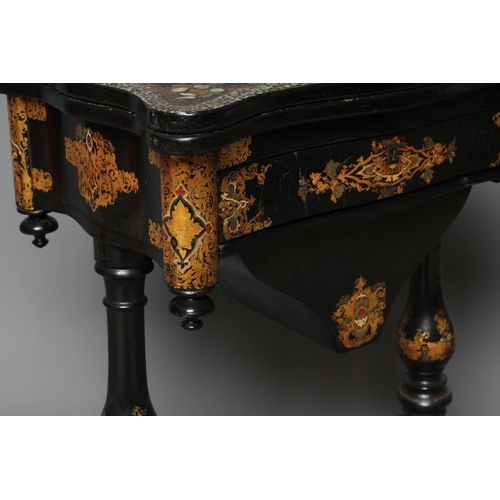 827 - A VICTORIAN PAPIER MACHE WORK/GAMES TABLE, third quarter 19th century, the oblong serpentine top pai... 