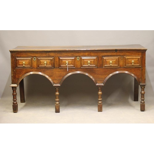 828 - A JOINED OAK DRESSER of late 17th century design, possibly 19th century and assembled using old wood... 