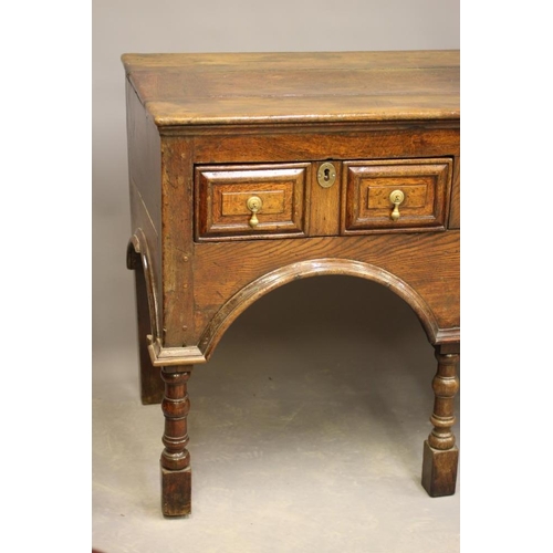 828 - A JOINED OAK DRESSER of late 17th century design, possibly 19th century and assembled using old wood... 