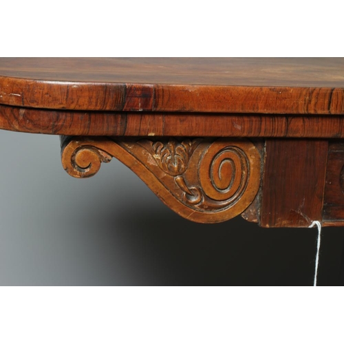 832 - A GEORGE IV ROSEWOOD FOLDING CARD TABLE, early 19th century, the rounded oblong swivel top opening t... 