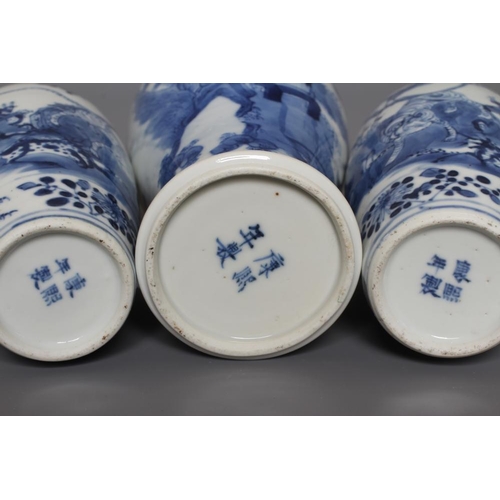 9 - A PAIR OF CHINESE PORCELAIN SMALL VASES of rounded cylindrical form, painted in underglaze blue with... 