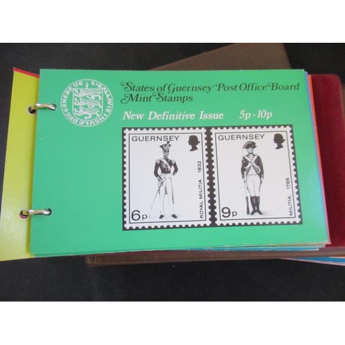 697 - THREE ALBUMS OF GUERNSEY AND ISLE OF MAN MINT DECIMAL STAMP PACKS