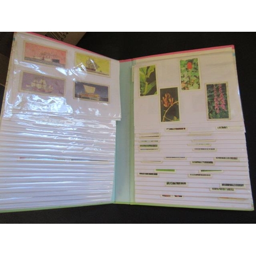 700 - FOUR ALBUMS OF CIGARETTE AND TEA TRADING CARDS