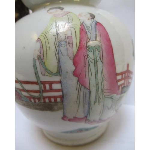 2 - A CHINESE PORCELAIN DOUBLE GOURD VASE painted in famille rose enamels with three figures in a fenced... 