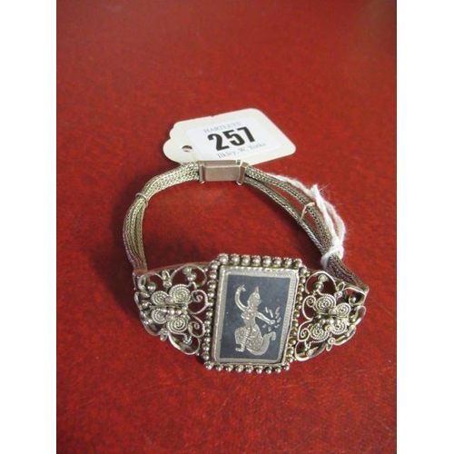 257 - VINTAGE WHITE METAL GODDESS BRACELET