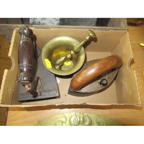 385 - TWO OLD IRONS AND A BRASS PESTLE AND MORTAR