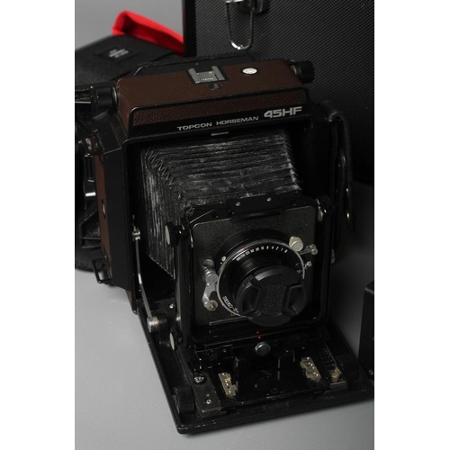 483 - A TOPCON HORSEMAN 45HF CAMERA with a Super Topcor 1:56 f=150mm lens, rotary back, viewer and black m... 