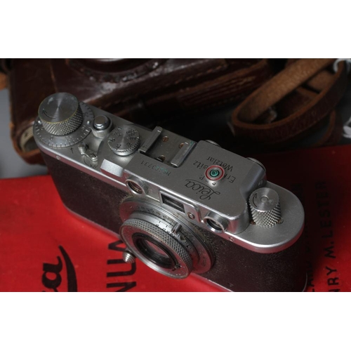 491 - A LEICA CAMERA, no. 263731, with Leitz Elmar f=5cm 1:35 lens, leather case and manual (Est. plus 24%... 