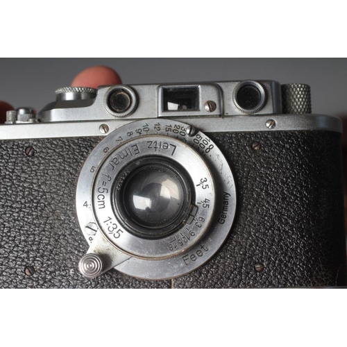 491 - A LEICA CAMERA, no. 263731, with Leitz Elmar f=5cm 1:35 lens, leather case and manual (Est. plus 24%... 