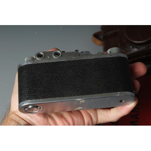 491 - A LEICA CAMERA, no. 263731, with Leitz Elmar f=5cm 1:35 lens, leather case and manual (Est. plus 24%... 