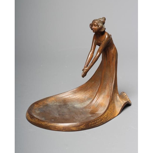 493 - AN ART NOUVEAU PATINATED COPPER FIGURAL DISH modelled as a young lady wearing a flowing dress, leani... 
