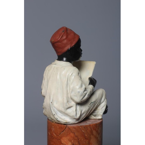 497 - A BERGMAN COLD PAINTED BRONZE ARAB BOY, early 20th century, the boy seated and raised on a column st... 