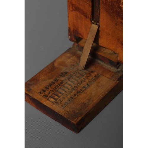 500 - A CHINESE WOOD COMPASS FLANKED BY TWO SUNDIALS, 19th century, the inclining sundials with iron needl... 