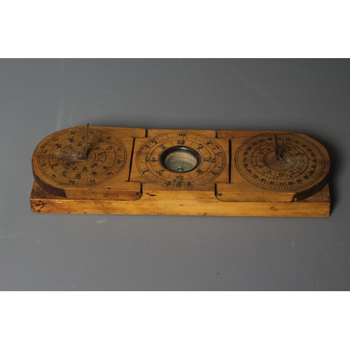 500 - A CHINESE WOOD COMPASS FLANKED BY TWO SUNDIALS, 19th century, the inclining sundials with iron needl... 