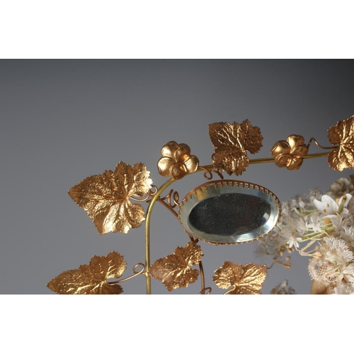 503 - A GLOBE DE MARIEE, French 19th century, the ivy leaf stamped gilt metal wirework frame centred by a ... 