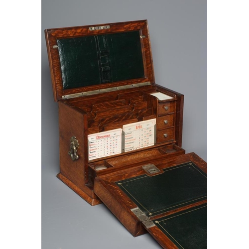508 - AN EDWARDIAN OAK STATIONERY BOX of oblong form with lightly domed hinged lid and two brass handles, ... 