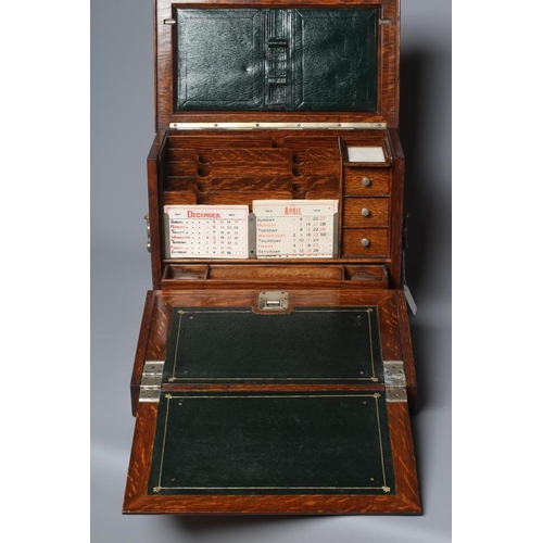 508 - AN EDWARDIAN OAK STATIONERY BOX of oblong form with lightly domed hinged lid and two brass handles, ... 