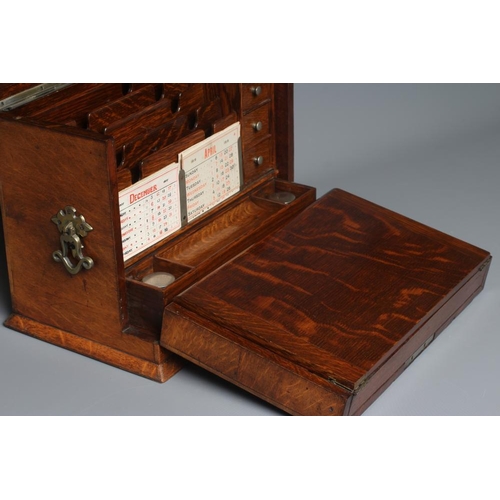 508 - AN EDWARDIAN OAK STATIONERY BOX of oblong form with lightly domed hinged lid and two brass handles, ... 