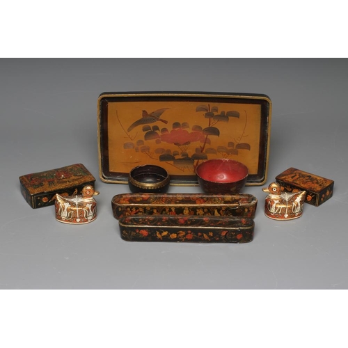 509 - NINE PERSIAN SCHOOL LACQUERED PAPIER MACHE ITEMS comprising two pen boxes, largest 9
