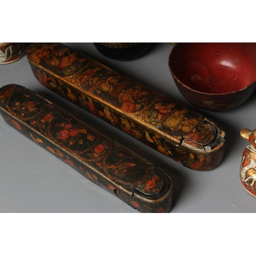 509 - NINE PERSIAN SCHOOL LACQUERED PAPIER MACHE ITEMS comprising two pen boxes, largest 9