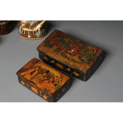 509 - NINE PERSIAN SCHOOL LACQUERED PAPIER MACHE ITEMS comprising two pen boxes, largest 9