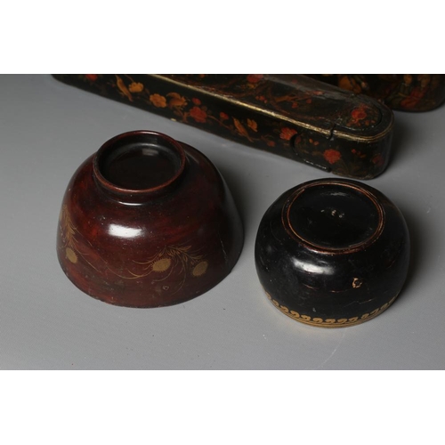 509 - NINE PERSIAN SCHOOL LACQUERED PAPIER MACHE ITEMS comprising two pen boxes, largest 9