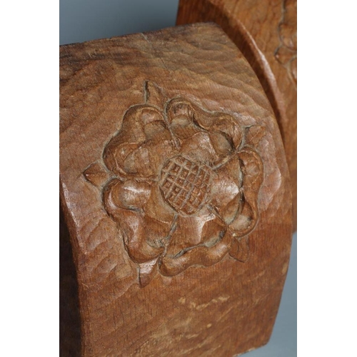 516 - A PAIR OF THOMAS WHITTAKER OAK BOOKENDS of domed form carved with a Yorkshire Rose and incised gnome... 