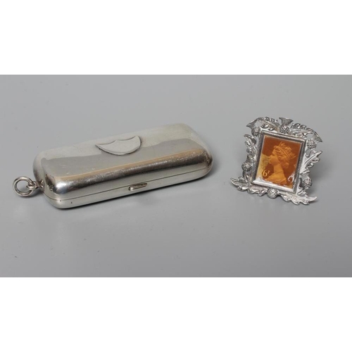 140 - OF PHILATELIC INTEREST - AN EDWARDIAN STAMP, SOVEREIGN AND HALF SOVEREIGN HOLDER, by A J Zimmerman, ... 