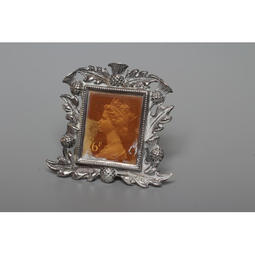 140 - OF PHILATELIC INTEREST - AN EDWARDIAN STAMP, SOVEREIGN AND HALF SOVEREIGN HOLDER, by A J Zimmerman, ... 