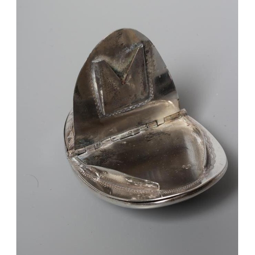 143 - OF PHILATELIC INTEREST - A SNUFF/STAMP BOX, unmarked, of concave oval form with engraved decoration ... 