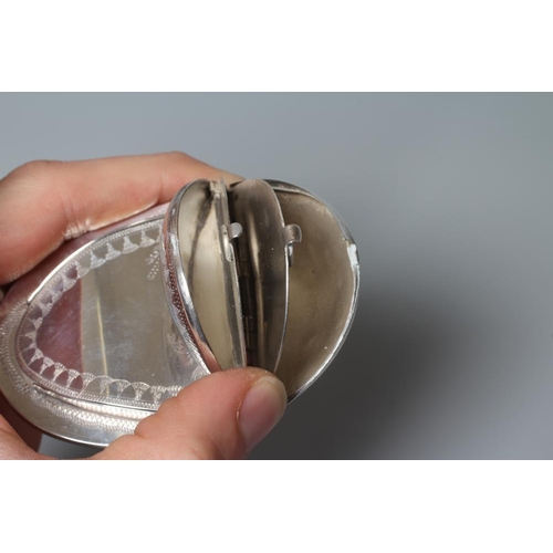 143 - OF PHILATELIC INTEREST - A SNUFF/STAMP BOX, unmarked, of concave oval form with engraved decoration ... 