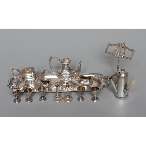 157 - A COLLECTION OF SILVER TOYS comprising a novelty café-au-lait pepperette by William Vale, Birmingham... 