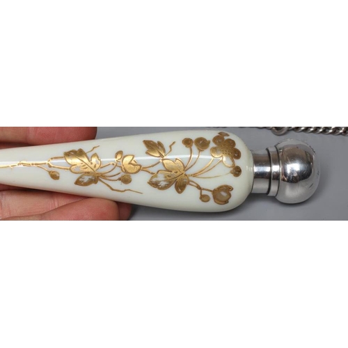 160 - A THOMAS WEBB CREAM OPALINE GLASS SCENT FLASK of conical form with gilded flowers in the style of Ju... 