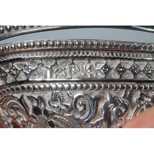 171 - A VICTORIAN SILVER OVAL SUGAR BASKET by John Aldwinckle & Thomas Slater, London 1887, chased and rep... 