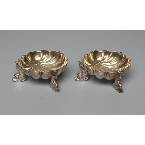 176 - A PAIR OF VICTORIAN SILVER SHELL SALTS by Henry Hall & John Edward Bingham, Sheffield 1868, raised u... 