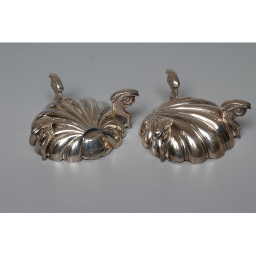 176 - A PAIR OF VICTORIAN SILVER SHELL SALTS by Henry Hall & John Edward Bingham, Sheffield 1868, raised u... 
