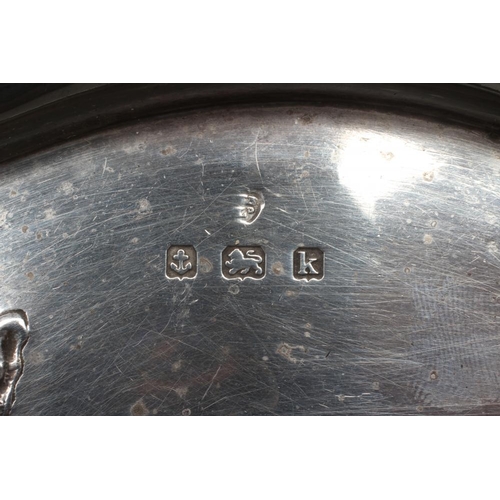 179 - AN EDWARDIAN SILVER ART NOUVEAU DRESSING TABLE TRAY, maker's mark rubbed, Birmingham 1909, of quatre... 