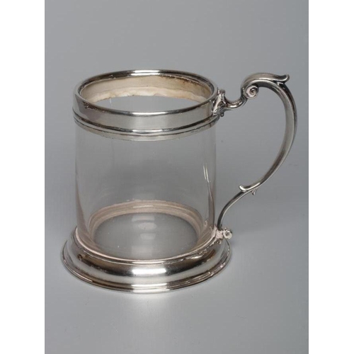 185 - AN EARLY VICTORIAN SILVER MUG by John Wilmin Figg, London 1856, the clear glass cylindrical body wit... 
