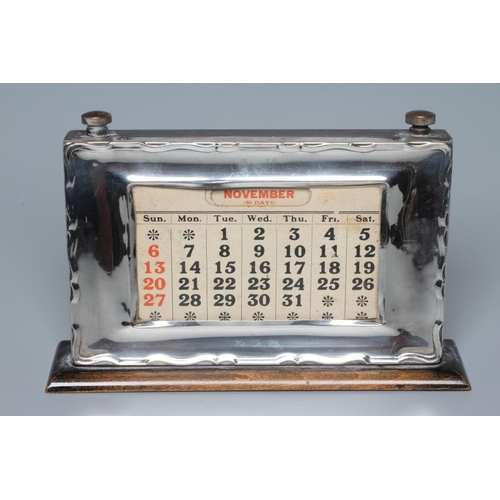190 - A GEORGE V SILVER PERPETUAL DESK CALENDAR by W J Myatt & Co., Birmingham 1928, of oblong form, the a... 